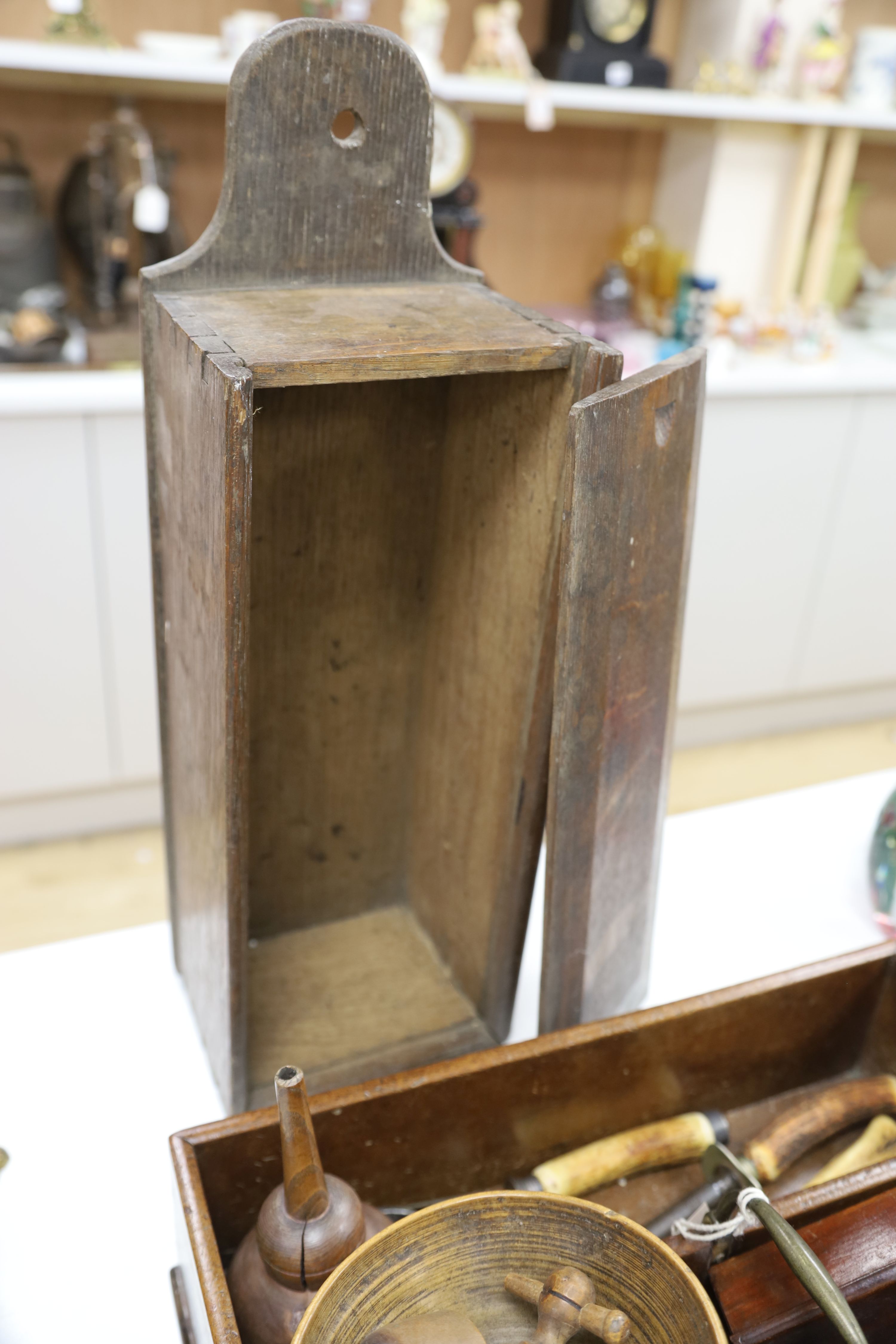 A 19th century oak candle box, a corbel, cutlery tray and sundry treen items